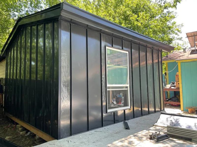 Black standing seam metal wall panels for Roof Inspection in Lake Charles